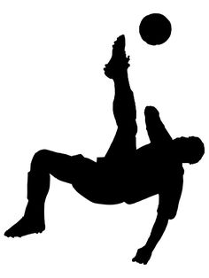 a silhouette of a man kicking a soccer ball into the air with his leg in the air