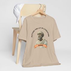 Embrace your love for literature with our Homer Putting the Lit in Literature T-Shirt! This stylish tee is perfect for book lovers, Literature teacher or anyone who appreciates the brilliance of Homer's work. Made with premium quality materials, it offers comfort and style in one. Wear this tee proudly and showcase your passion for great literature! HOW TO ORDER? 1️) Please review all the information provided before placing an order. 2️) Select the size. 3️) Select the color of the shirt 4) Select Personalization if applicable.  Fill in your information in the drop down box. 5) Need more Items? Add your current item to your cart and if you would like to add more items to your order, please click the back button and repeat steps 1-4 again. 6) Once all your desired items are in your cart you Literary Relaxed Fit Crew Neck T-shirt, Literary Letter Print Crew Neck T-shirt, Literary Style T-shirt With Letter Print And Crew Neck, Literary Graphic Print Crew Neck T-shirt, Screen Print Crew Neck T-shirt, Literary Crew Neck T-shirt With Screen Print, Funny Literature, Literature Teacher, English Teacher Gifts