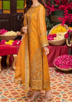 Introducing our New collection 'PYAAR DIYAN GALLAN' by Asim Jofa designed to make you look and feel your best. Immerse yourself in a sunlit meadow with this delightful sunshine-infused masterpiece. The mustard-hued shirt boasts embroidery that bursts with the joy of a harvest festival, embellished with warm honey-toned sequins accented by antique gold zariwork. This intricate artistry elevates the airy organza, transforming it into a canvas that radiates warmth like a summer sun. Paired with an embroidered, flowing dupatta featuring beautiful motifs, matches the regalia of the shirt with its serenity, unlocking a cultural treasure reimagined for the modern women. Embroidered Center Panel On Organza. Embroidered Side Panels Right and Left On Organza. Embroidered Border For Front Daman On Or Bohemian Orange Dress With Dupatta, Orange Bohemian Dress With Dupatta, Summer Anarkali Lawn Suit For Festive Occasions, Yellow Dabka Work Sets For Summer, Summer Festive Anarkali Lawn Suit, Summer Anarkali Dress With Dupatta, Summer Festive Lawn Suit With Dabka Detailing, Yellow Sets With Dabka Work For Summer, Summer Festive Lawn Suit With Dabka