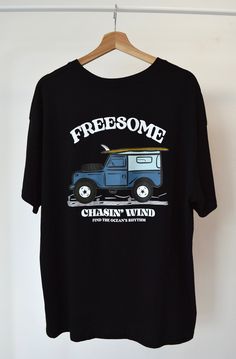 Embrace the spirit of adventure with our unique "Chasin' Wind" t-shirt, featuring an eye-catching design of a vintage Land Rover Defender with a surfboard. This handmade tee is perfect for adventurers, beach lovers, and anyone with a taste for the extraordinary. Designed and crafted by me in my home studio, each t-shirt is a unique piece of wearable art. Key Features: Unique Design: The bold graphic of a Land Rover Defender with a surfboard, designed by me, is sure to turn heads and start conver Surfing Crew Neck T-shirt With Front Print, Graphic Surfing T-shirt With Screen Print, Surfing Graphic Tee With Screen Print, Graphic Tee With Screen Print For Surfing, Graphic Tee T-shirt With Front Print For Surfing, Retro Crew Neck T-shirt With Custom Artwork, Crew Neck T-shirt With Front Print For Surfing, Surfing Graphic Tee With Crew Neck, Surfing Graphic Print Crew Neck T-shirt