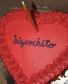 a heart shaped cake with the word biscochito written on it