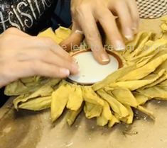 a woman is making something with her hands