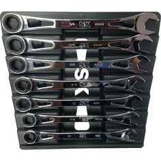 a bunch of wrenches sitting on top of each other