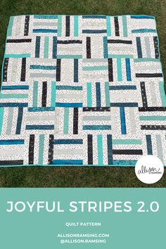 the joyful stripes 2 0 quilt pattern is shown in blue, white and black