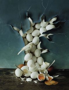 an image of eggs and birds in the middle of a tree made out of broken egg shells