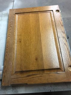 an unfinished cabinet door is sitting on the floor