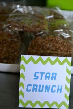 some food is sitting on a table with a sign that says star caunch