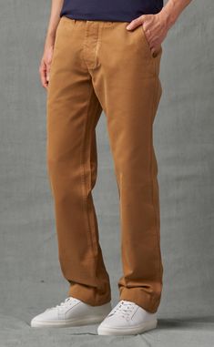 Inspired by traditional military gear, our officer chinos will add rugged appeal to your wardrobe. The heavyweight cotton twill fabric has excellent body and heft, and has also been garment-dyed for a softer finish and a broken-in look that gets better with every wash and wear. Unique details include adjustable button-tabs on the waistband, flapped rear pockets, and a button fly. Wear them with smart-casual pieces such as shirts, knitwear, boots, or even sneakers.

Model Sizing: Model has a 31.2 Casual Pieces, British Khaki, Military Gear, Khaki Chinos, Twill Fabric, Cotton Twill Fabric, Smart Casual, Cotton Twill, A Button