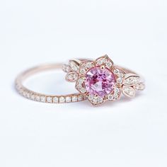 Natural 1.15ct Pink Sapphire & Diamond Unique Floral Engagement Ring, 14K Or 18K Gold, Vintage Pave Diamond Ring, Flower Ring - "Lily"
#PaveDiamondRing #LeafEngagementRing #ArtDecoRing #EngagementRing #PaveRing #GoldRingsForWomen #FlowerRing #GoldRing #LeafRing #ClusterRing Pink 14k Gold Flower Ring For Wedding, Pink Flower Jewelry With Prong Setting, Yellow Gold Flower Jewelry With Halo Setting, Flower-shaped Yellow Gold Jewelry With Halo Setting, Sapphire Diamond Engagement Ring, Jewelry Certificate, Diamond Sapphire Engagement Ring, Sapphire Diamond Engagement, Leaf Engagement Ring