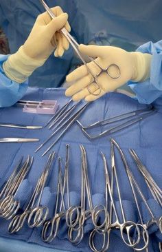 surgical instruments are being used to treat the patient