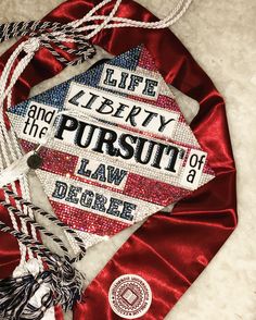 a graduation cap with the words life liberty and the pursuit of a law degree