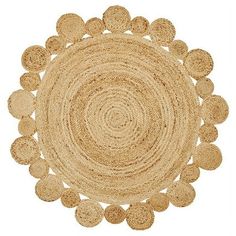 a round rug with many circles on the bottom and one circle in the middle, is shown