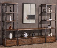 an entertainment center with shelves and vases on it