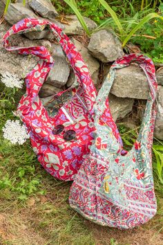 This awesome hippie handbag features two block print tapestry prints, so you can have one bag to go with everything! With a patch pocket on both sides, this retro tote is two handbags in one! These huge reversible hippie bags are ideal for carrying groceries or as a general tote, and the strap is long enough to wear comfortably as a crossbody bag. 100% cotton 2 pockets inside and outsideMeasurementsDepth: 14", Width: 20", Strap length: 19" Everyday Bohemian Cotton Hobo Bag, Bohemian Reversible Hobo Bag For Everyday Use, Bohemian Red Hobo Bag For Everyday, Red Bohemian Hobo Bag For Everyday, Bohemian Reversible Hobo Bag For Travel, Hippie Style Cotton Bags For Everyday, Bohemian Reversible Hobo Bag For Daily Use, Bohemian Square Cotton Bag, Hippie Cotton Bags For Everyday Use