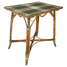 a small table made out of bamboo with green and white tiles on the top, sitting in front of a white background