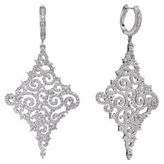 A delicate pair of drop earrings, intricately designed oozing instant Hollywood glamour. Featuring 8.00ct of round brilliant cut cubic zirconia, suspended from a lever back fastening, stunningly handcrafted in 925 sterling silver with a high gloss white rhodium finish. Dimensions 60mm drop by 30mm diameter. Also available with a 14kt rose gold finish. Drop Statement Earrings, English Art, Silver Lace, Rose Lace, Statement Drop Earrings, Hollywood Glamour, Round Brilliant, Or Rose, Statement Earrings