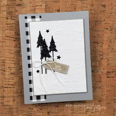 a card with trees and stars on it