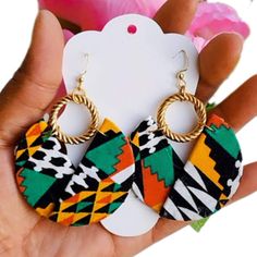 These outstanding  unique handmade earrings are made with vibrant African print also known as Ankara fabric. The beauty of these earrings is that they have multiple colors which means they will go with different outfits. They are also super light weight. You could wear these statement african earrings to different occassion. They are must have earrings.   You could follow me on my Instagram account @lidizafrifabs 4b Hairstyles, Photoshoot Accessories, Ankara Earrings, Diy Earrings Easy, African Accessories, Unique Handmade Earrings, Bracelets Handmade Diy, African Earrings, Bead Charms Diy