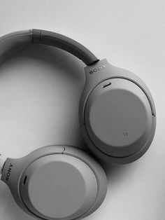 the sony headphones are on display in this black and white photo - like image