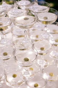 many wine glasses sitting on top of each other