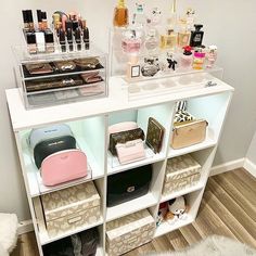 a white shelf filled with lots of different types of cosmetics and other personal care items