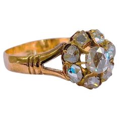 a gold ring with several stones on it