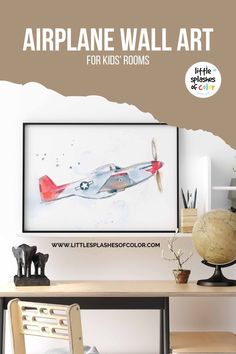 the airplane wall art for kids rooms is displayed in front of a desk and chair