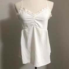 Bnwt White Adjustable, Cross Back Straps Soft, Silky Material With Lace Trim White V-neck Tank Top With Delicate Straps, White Beach Camisole With Built-in Bra, Brunch Camisole With Built-in Bra, Feminine Camisole With Built-in Bra For Vacation, White Tank Top With Built-in Bra For Day Out, White Cami Tank Top With Built-in Bra, White Spaghetti Strap Tank Top With Delicate Straps, White Tank Camisole With Delicate Straps, White Camisole With Spaghetti Straps