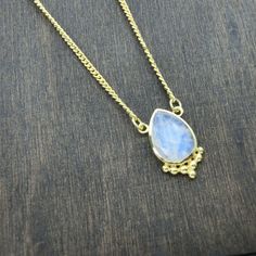 A feminine & timeless necklace with an enchanting drop-shaped Moonstone. The Moonstone is decorated with dotted details at the lower edge. Perfect for layering or worn alone for a simple but stylish look. The brass has a warm gold tone & is nickel-free. The Moonstone represents femininity, intuition, balance & wishes. ～As Ancient as the Moon itself～ Size Guide: Adjustable size Length: 35 - 45 cm Material: Brass (nickel-free) Stone: Moonstone 10x14 mm Back to storefront: www.etsy.com/ Elegant Moon Phase Jewelry For Festivals, Elegant Moonstone Jewelry For Festivals, Elegant Moon Phase Festival Jewelry, Bohemian Moonstone Jewelry With Gemstone Accents, Bohemian Teardrop Jewelry With Gemstone Accents, Bohemian Teardrop Jewelry With Adjustable Chain, Delicate Moonstone Drop Jewelry, Bohemian Jewelry With Adjustable Teardrop Chain, Gold Drop Bohemian Necklace