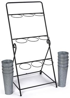 a metal rack with two buckets next to it on a white background and one is empty