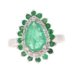 This Pear Cut Emerald ring has a 1.46 Carat Natural Emerald that measures at 7 mm x 9 mm. It is further embellished with 18 Emeralds that weigh 0.47 Carats and 18 Round Cut Diamonds that weigh 0.40 Carats. The total carat weight of the ring is 2.33 Carats. Curated in 18 Karat White Gold and weighs approximately 5.6 grams This ring is a size of 7 and can be re-sized at no additional charge. Dazzling Pear-shaped Gia Certified Rings, Exquisite Pear-shaped Gia Certified Rings, Formal Green Pear-shaped Rings, Formal Pear-shaped Emerald Ring In White Gold, Teardrop Emerald Ring With Prong Setting, Fine Jewelry Pear-shaped Multi-stone, Green Teardrop Luxury Rings, Luxury Green Teardrop Ring, Fine Jewelry Emerald Ring With Cluster Shape In Platinum