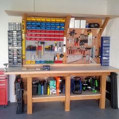 a workbench with tools and other items on the table in front of it