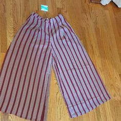 Umgee Women's Wide-Leg Pants. Soft And Flowy Polyester. Pleated Front With Pockets. Burgundy With Off-White Stripes. Trendy Red Wide Leg Pants For Summer, Red Wide Leg Bottoms For Day Out, Trendy Red Pants For Day Out, Red Wide Leg Pants For Day Out, Red Wide-leg Pants For Day Out, Black Bell Bottoms, Ruffle Linen, Camouflage Pants, Womens Wide Leg Pants