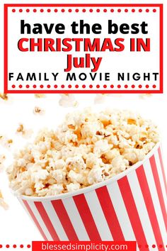 a red and white striped popcorn bucket with the words have the best christmas in july family movie night