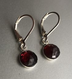 "Genuine Garnet Earrings Sterling Silver, Red Garnet Earrings Drop, January birthstone These garnet earrings will make a great gift! They made from: - Genuine faceted Mozambique red garnet 8mm cabochons set in sterling silver - Sterling silver lever back ear wires The earrings are about 1 \" long. Your order will be mailed within 2 business days nicely packaged and ready to be given. All US orders and most international orders will have tracking#. To see more of my jewelry: https://www.etsy.com/ Garnet Drop Earrings With Ear Wire, Nickel-free Garnet Drop Earrings, Garnet Gemstone Drop Earrings, Garnet Drop Earrings With Matching Set, Formal Dangle Garnet Earrings, Formal Garnet Dangle Earrings, Elegant Cranberry Garnet Jewelry, Nickel Free Ruby Earrings As A Gift, Nickel-free Ruby Earrings As A Gift