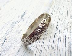 Floral Pattern Sterling Silver Ring Wedding by wwcsilverjewelry, $40.00 Nature-inspired Flower Wedding Rings, Engraved White Gold Flower Ring For Wedding, Heirloom Wedding Flower Ring With Engraving, Heirloom Wedding Flower Ring Engraved, Vintage Wedding Toe Ring With Flower Design, Vintage Wedding Flower Toe Ring, Nature-inspired Engraved Wedding Rings, Wedding Engraved Ring With Etched Details, Silver Round Flower Ring For Marriage