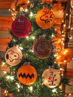 a christmas tree decorated with ornaments in the shape of peanuts and charlie brown on it