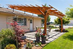 an outdoor patio with potted plants and flowers