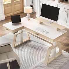 a computer desk with a monitor and keyboard on it in a room next to a chair