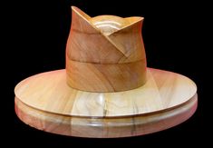 "Set WK 2401 with a brim slightly falling to the sides. Front and sides 10 cm, back 9 cm, complete with a replica of a wonderful fancy crown, its height is 15 cm. The whole creates a unique composition. The hat block you receive may differ in color and grain from the block in the image above. ----------------------------------------------------------------- STANDARD FEATURES INFO : 1. Our blocks are made of linden wood (also called lime tree or basswood) or European poplar (also called aspen or cottonwood). It depends on particular order which one we're using (lime tree tends to be a bit more yielding). Both of them are soft, smooth, milliner-friendly and easy to use blocking pins on.  Sometimes when blocks are intended for machine use, after consultation with the customer, we are making t Hat Blocks For Sale, Fancy Crown, Head Crown, Block Head, Unique Composition, Millinery Supplies, Hat Blocks, Lime Tree, Large Hats