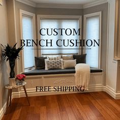 a window seat with the words custom bench cushion free shipping on it in front of a wooden floor