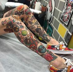 a person with tattoos on their legs and feet