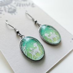 Woodland Friends Earrings Papercut Illustration Earrings - Etsy Whimsical Hand Painted Earrings For Gifts, Artistic Green Earrings For Gift, Whimsical Resin Dangle Earrings, Friends Earrings, Whimsical Nickel-free Resin Earrings, Handmade Nature-inspired Resin Earrings, Papercut Illustration, Whimsical Mushroom-shaped Earrings For Gifts, Paper Cut Artists