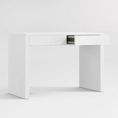 a white desk with an open drawer on the top and bottom section, in front of a plain background