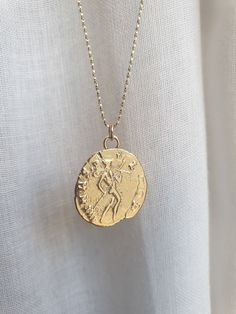 This 14k solid gold coin necklace was 100% handmade and has an antique Roman coin for a pendant. The necklace is available with 14k solid gold or 14k gold filled chain. The pendant is available in 9k or 14k solid gold. You can also buy the pendant only if you wish. Dimensions: The 14k gold necklace is available in multiple lengths. The antique coin pendent's diameter is 1.5 cm (0.6 inches) This ancient coin necklace is unique and beautiful and will serve you long and well. To see other necklaces Yellow Gold Sterling Silver Coin Medallion Necklace, Antique Gold Sterling Silver Coin Necklace, Antique Sterling Silver Gold Coin Necklace, Sterling Silver Gold Medallion Coin Necklace, Yellow Gold Coin Pendant Necklace In Sterling Silver, Antique Coin Necklace Tarnish Resistant, Antique Coin-shaped Tarnish Resistant Necklace, 14k Gold Tarnish Resistant Coin Necklace, 14k Gold Tarnish-resistant Coin Necklace