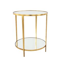 a round glass table with gold metal frame