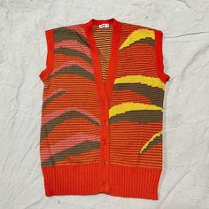 Vintage 80's Rodier knit pineapple sweater vest. Button front cardigan style sweater vest with abstract Missoni style pineapple pattern. Vibrant orange, pink, and yellow. Made in France. 54% cotton 46% acrylic. Fits a range of sizes, small, medium, large, depending on how you want it to fit. Check measurements to ensure fit- -Measurements (lying flat)- Shoulder: 18.5" Chest: 18.5" Length: 26" Trendy Multicolor Cotton Vest, Retro Cotton Sweater Vest For Spring, Retro Cotton Sweater Vest For Fall, Multicolor Cotton Sweater Vest For Winter, Retro Summer Cotton Sweater, Retro Knit Sweater Vest For Fall, Vintage Cotton Cardigan For Summer, Retro Knit Sweater Vest For Spring, Vintage Cotton Summer Cardigan