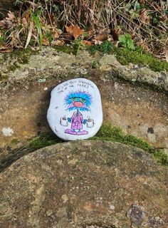 a rock with a cartoon character painted on it