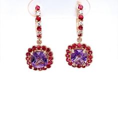 These cute and dainty Earrings have 2 Cushion Cut Amethysts that weigh 2.27 Carats and are embellished with 46 Round Cut Red and White Sapphires that weigh 1.56 Carats. The Total Carat weight of the Earrings are 3.83 Carats. The Earrings are about an 1.2 inches in length They are beautifully set in 14 Karat Rose Gold and weigh approximately 4.9 Grams.   Exact dimensions for this item are unknown. Please reach out in the seller Q&A for any questions on measurements. Elegant Rose Gold Multi-stone Earrings, Luxury Purple Multi-stone Earrings, Formal Amethyst Jewelry For Valentine's Day, Fine Jewelry Purple Drop Earrings, Purple Multi-stone Earrings For Anniversary, Rose Gold Earrings With Gemstone Accents, Purple Earrings For Valentine's Day, Multi-stone Earrings For Anniversary, Pink Multi-stone Earrings For Anniversary