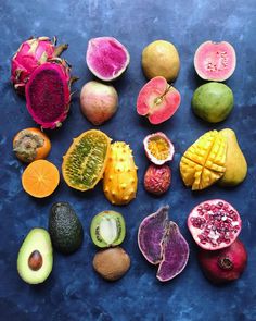 there are many different types of fruit on the table together, including kiwis and mangoes